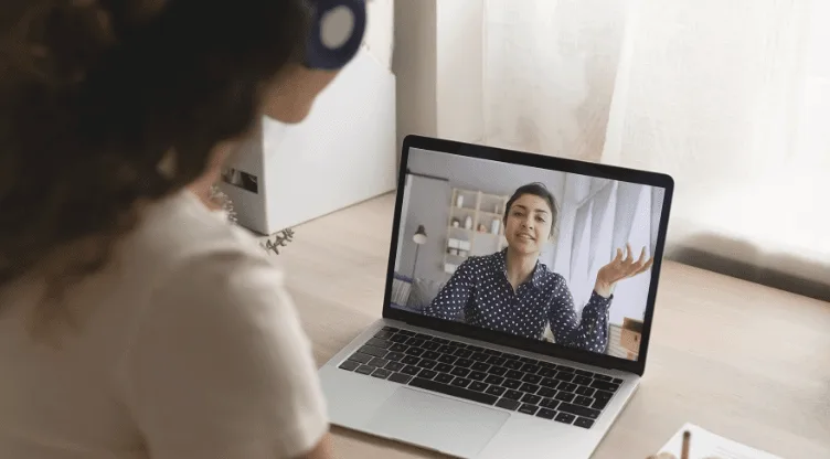 tutor teaching in front of laptop